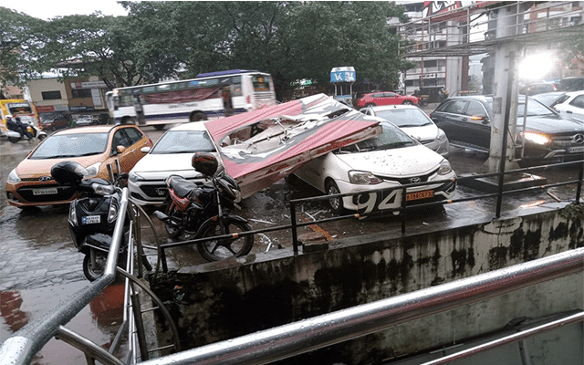Two cars damaged after board collapses at Shivabagh