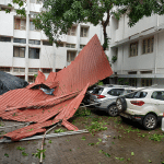 Six cars damaged as iron roof collapses