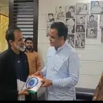 Minister presents national flag to Dr Raj's family