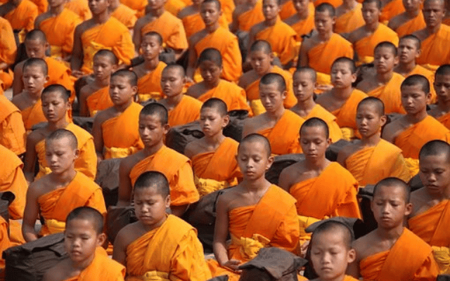 Buddhist monks clean Sannati Buddha Vihara
