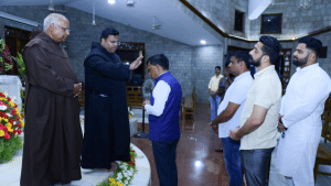 SL Hon'ble Bojegowda greets Child Jesus on his annual mahotsava