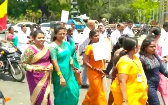 Nanjangud: Officers and staff, dressed in traditional attire, took to the streets.