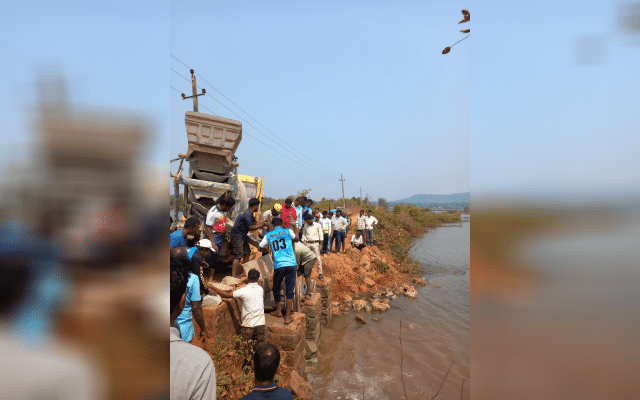 Villagers block gate with concrete over salt water