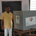 K. Gopal Pujari voting along with his wife